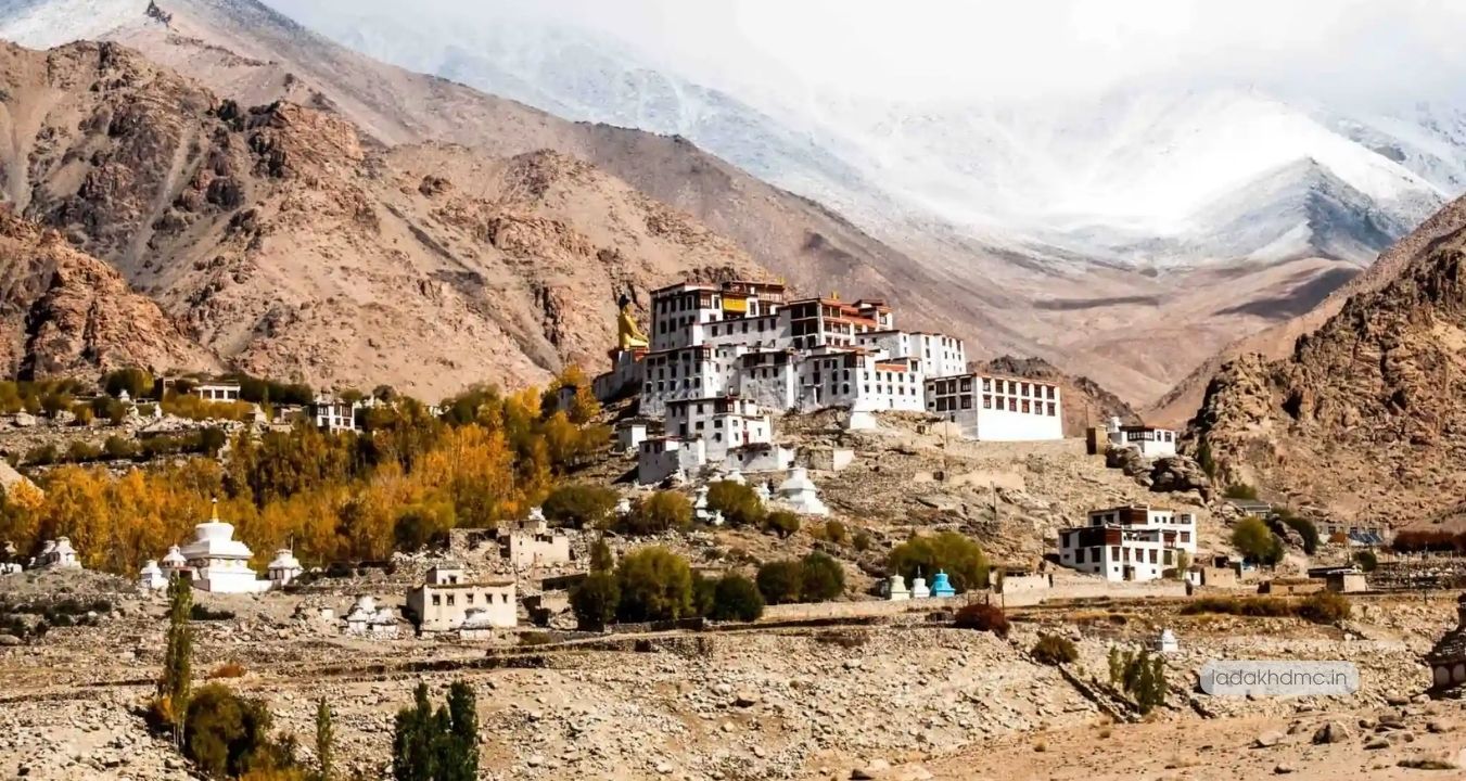 Interior of Alchi Monastery prayer hall with monks and ancient Buddhist murals in Leh, Ladakh