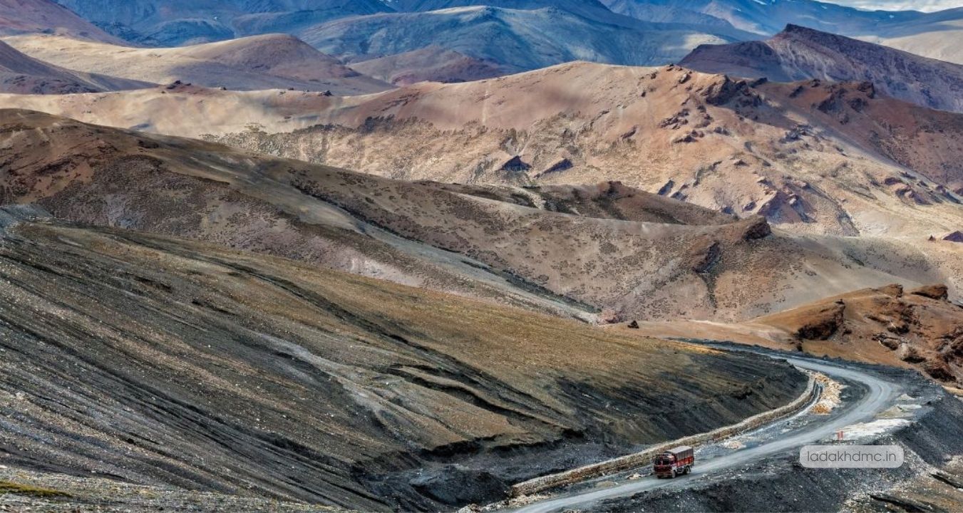 Scenic view of Magnetic Hill with winding road and Himalayan backdrop