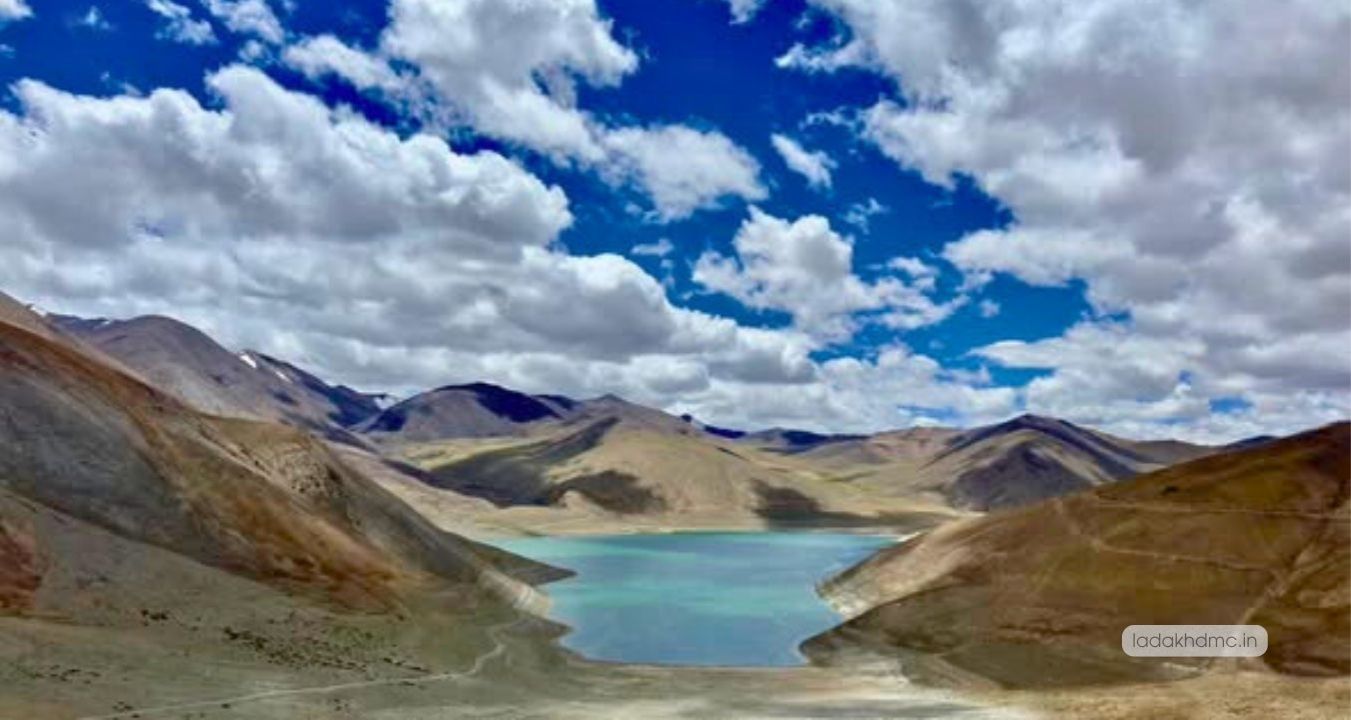 Panoramic view of Mirpal Tso Lake with turquoise waters and snow-capped Himalayan peaks in Leh Ladakh