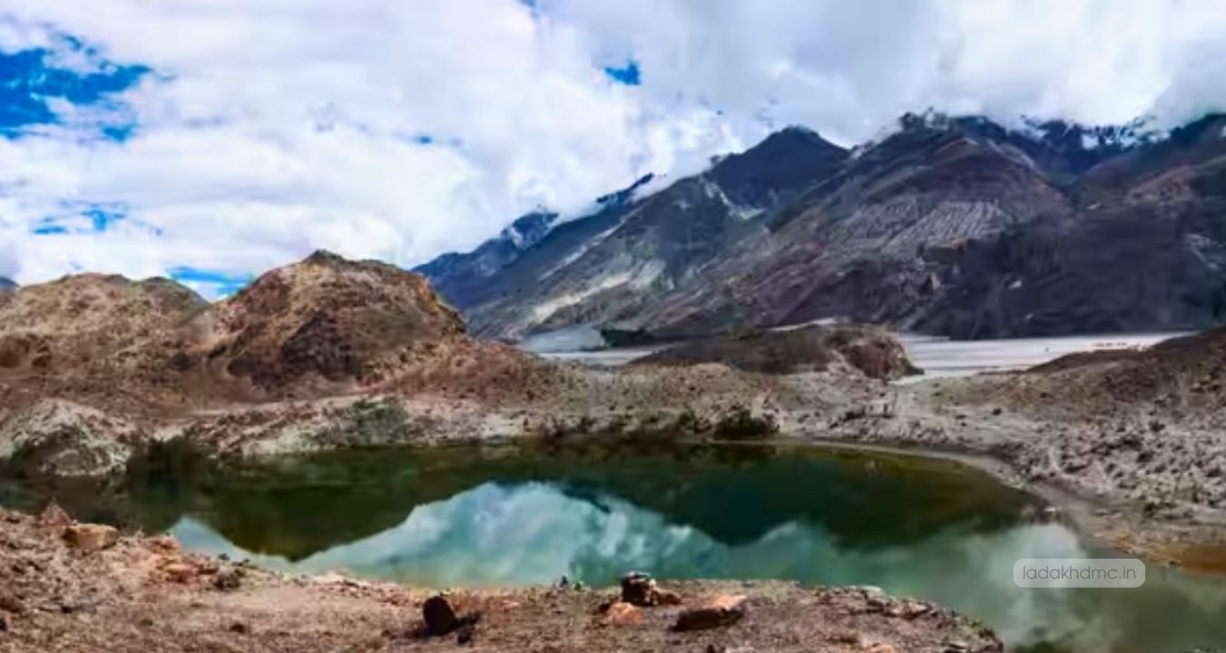 Yarab Tso Lake reflecting shades of turquoise and blue under clear skies in Ladakh