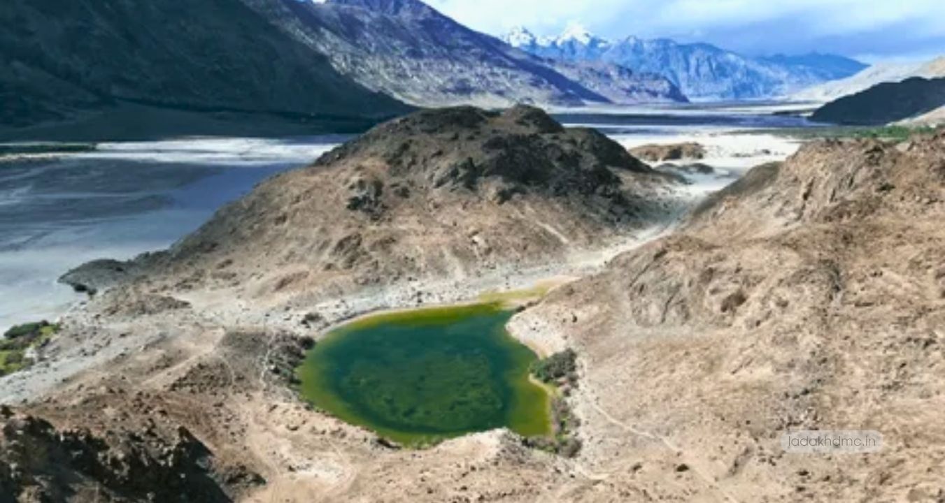 Panoramic view of Yarab Tso Lake with turquoise waters and dramatic Himalayan landscape in Ladakh
