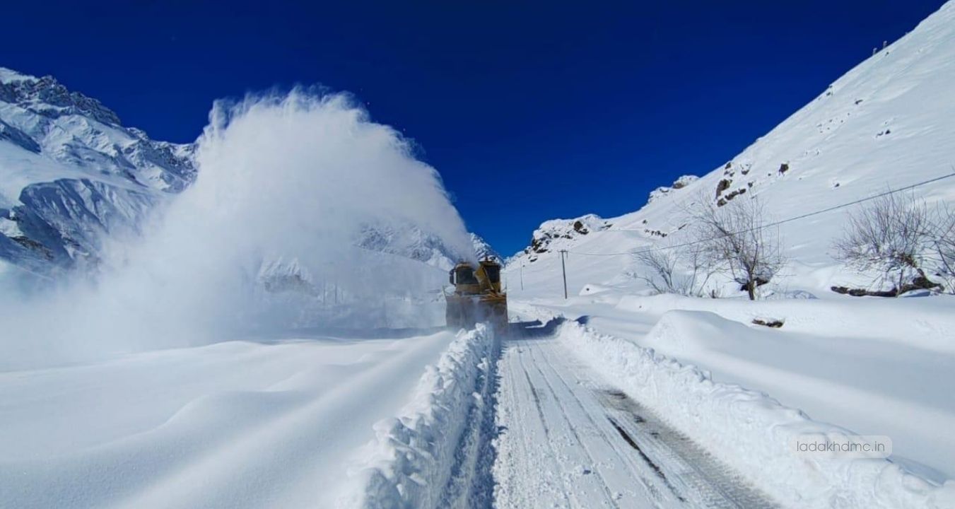 Panoramic view of Zojila Pass with winding roads, mountain peaks, and Himalayan landscape in Ladakh